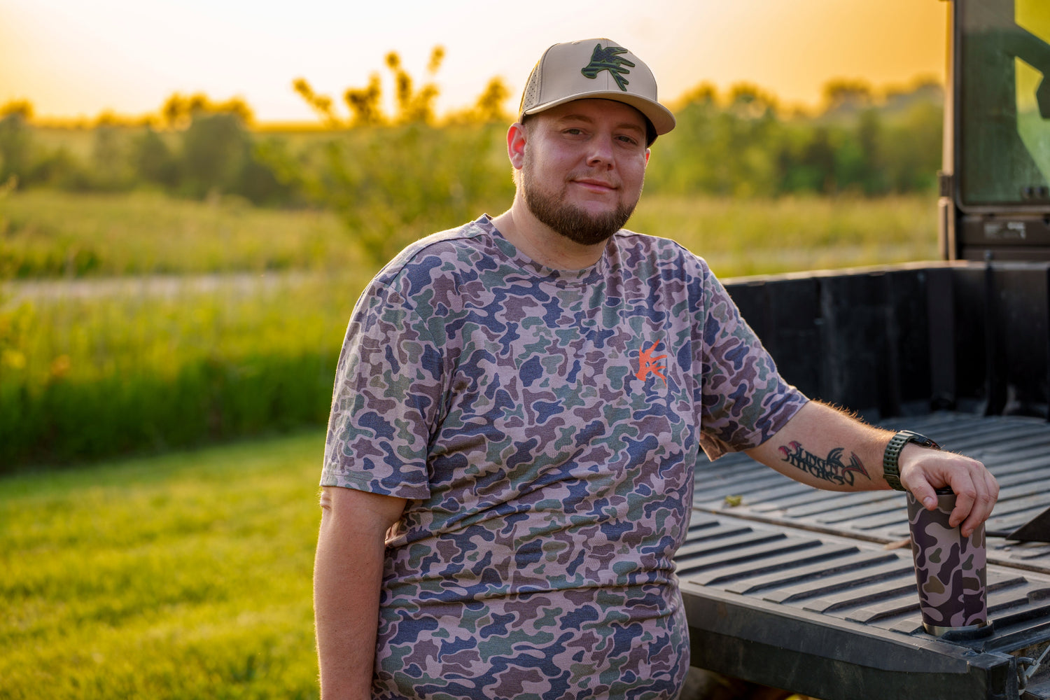 Douglas the owner wearing our ultra camo shirt
