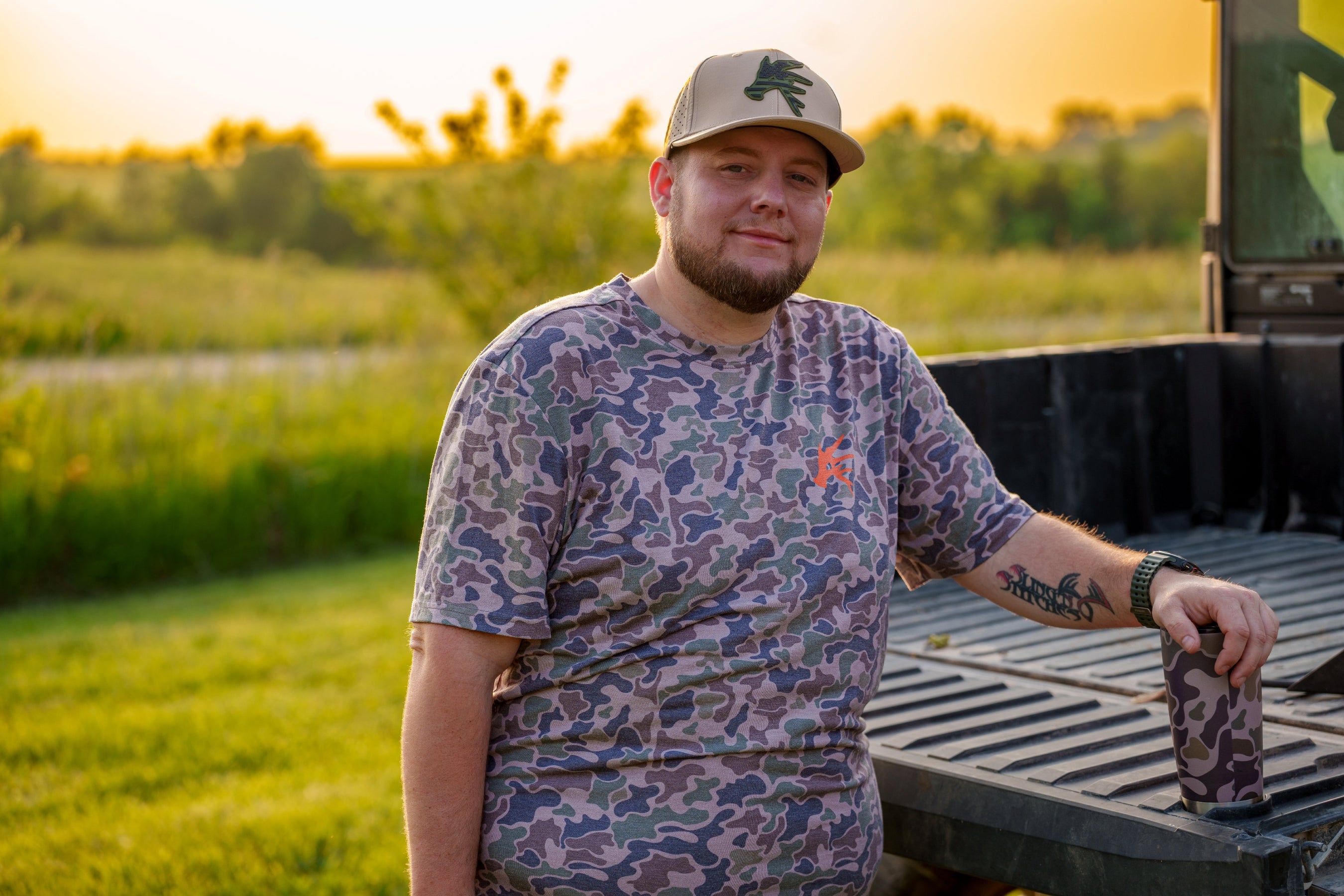 Douglas the owner wearing our ultra camo shirt
